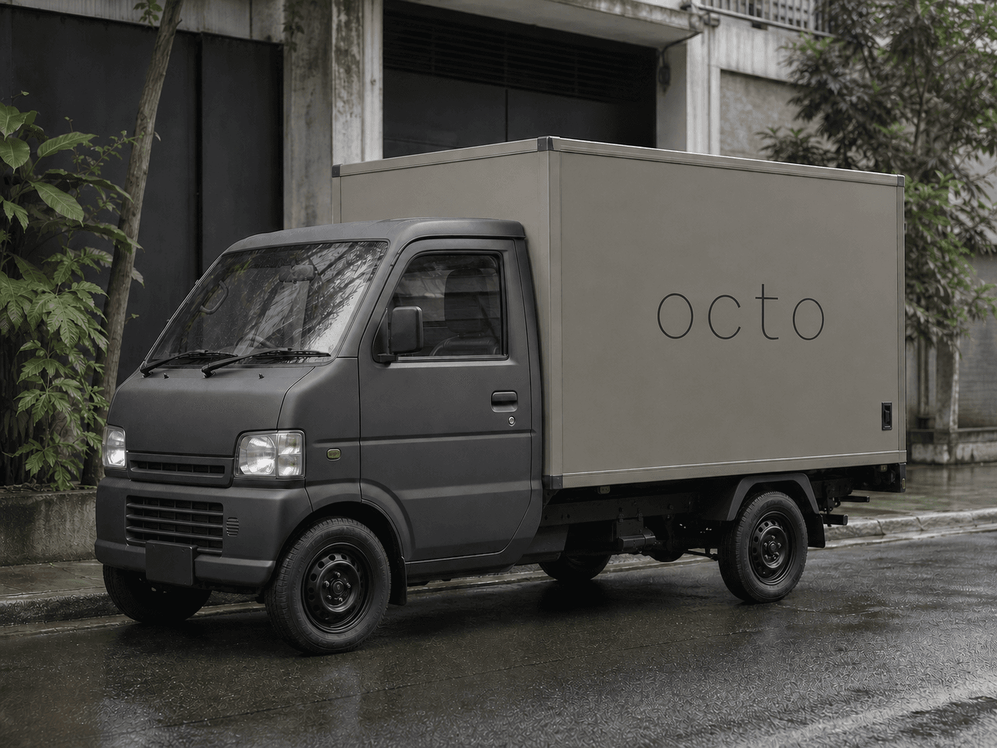 รถส่งสินค้าขนาดเล็กที่มีโลโก้ octo สื่อถึงการส่งมอบสินค้า